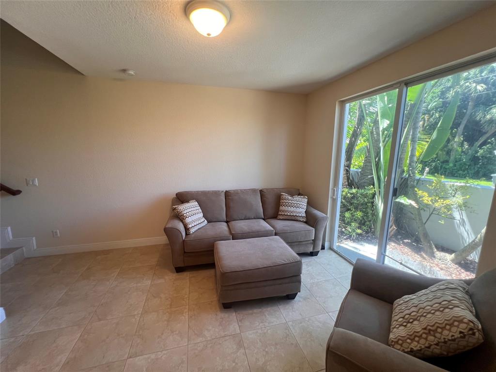 3014 Waterside Circle Boynton Beach, FL 33435 - Photo 8 of 40 a living room with furniture and a large window