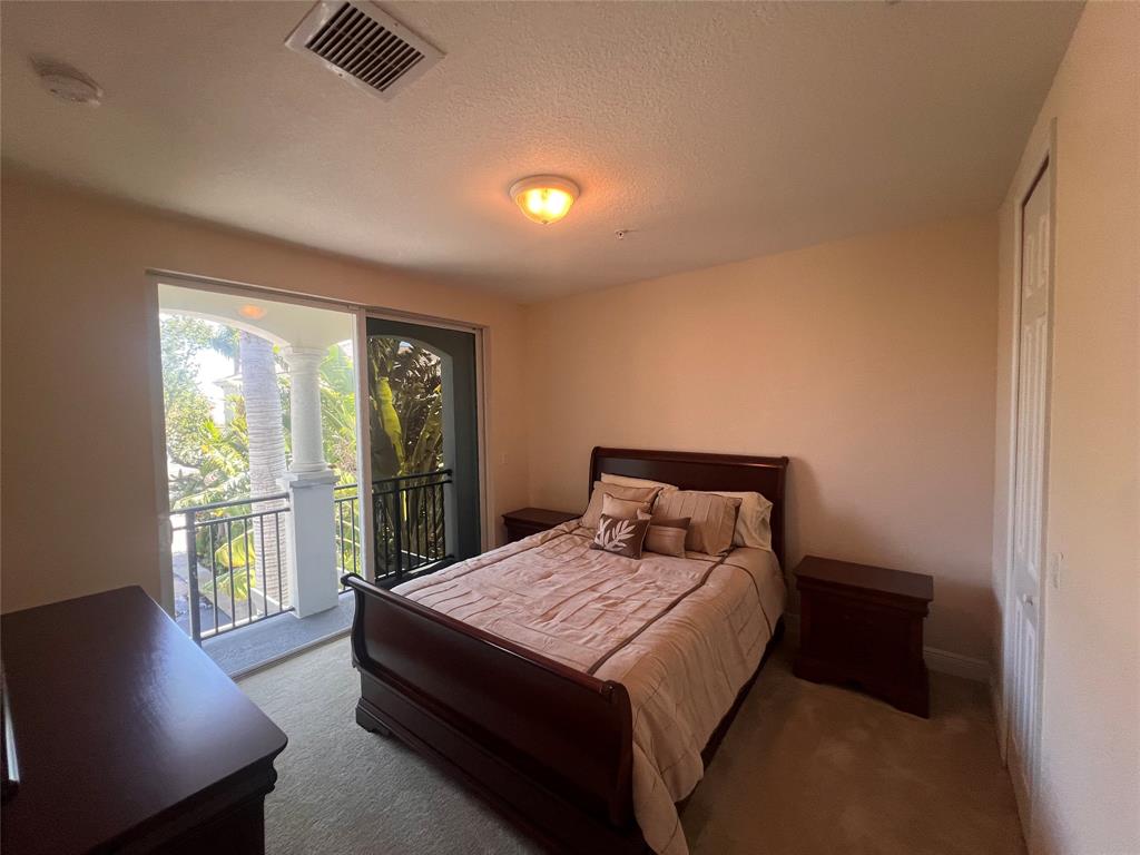 3014 Waterside Circle Boynton Beach, FL 33435 - Photo 10 of 40 a bed sitting in a bedroom next to a window