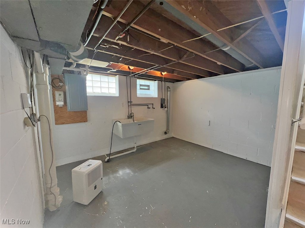 28642 Forest Road Willowick, OH 44095 - Photo 19 of 23 Below grade area featuring electric panel and a sink