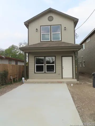 front view of a house with a large window