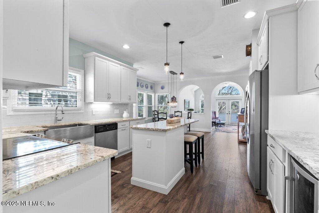 2307 Beachcomber Trail Atlantic Beach, FL 32233 - Photo 23 of 75 a kitchen with counter top space a sink appliances and cabinets