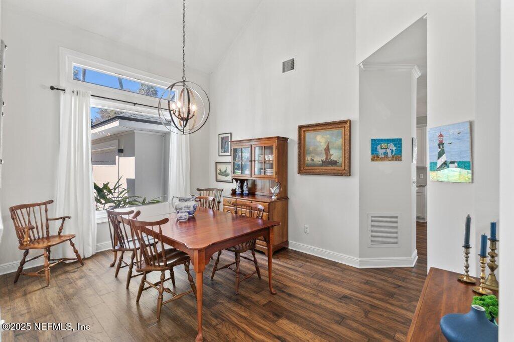 2307 Beachcomber Trail Atlantic Beach, FL 32233 - Photo 25 of 75 a view of a dining room with furniture a chandelier and wooden floor