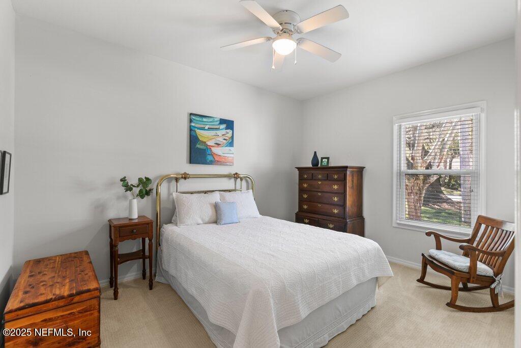 2307 Beachcomber Trail Atlantic Beach, FL 32233 - Photo 34 of 75 a bedroom with a bed and chair