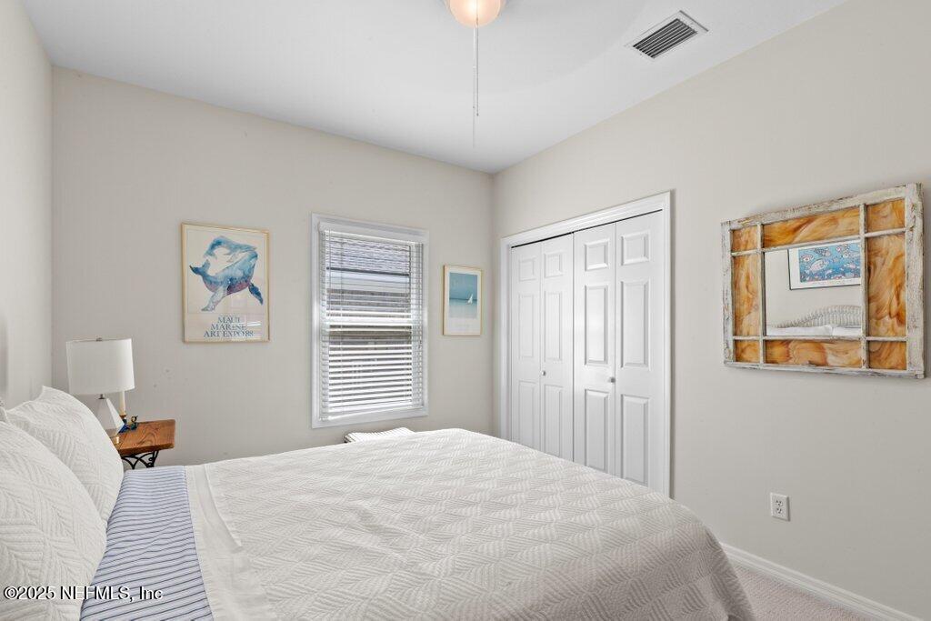 2307 Beachcomber Trail Atlantic Beach, FL 32233 - Photo 39 of 75 a bedroom with a bed and a window