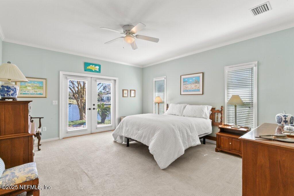 2307 Beachcomber Trail Atlantic Beach, FL 32233 - Photo 40 of 75 a spacious bedroom with a bed painting on wall and windows