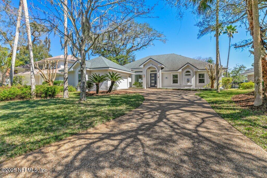 2307 Beachcomber Trail Atlantic Beach, FL 32233 - Photo 4 of 75 a front view of a house with a yard