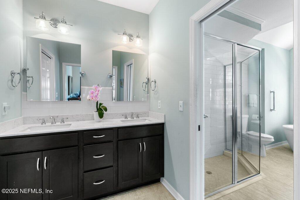 2307 Beachcomber Trail Atlantic Beach, FL 32233 - Photo 46 of 75 a bathroom with a shower sink and mirror