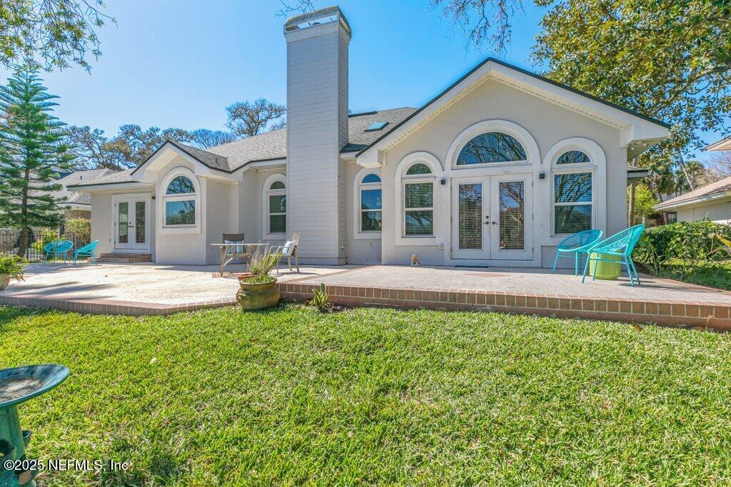 2307 Beachcomber Trail Atlantic Beach, FL 32233 - Photo 57 of 75 a front view of a house with a yard