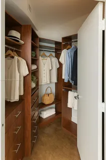 a bathroom with a granite countertop sink a toilet and a shower