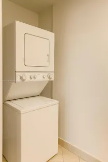 a view of a balcony with wooden chairs