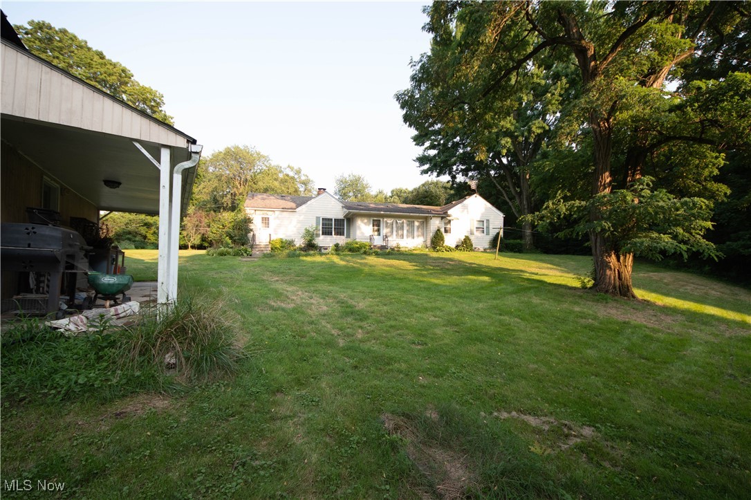9719 Angling Road Wakeman, OH 44889 - Photo 28 of 39 View of green lawn featuring a patio area