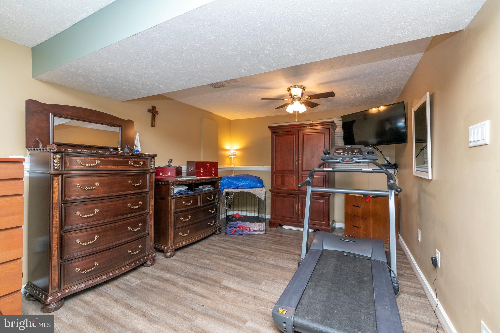 8624 Lawrence Hill Road Perry Hall, MD 21128 - Photo 29 of 39 a bedroom with a bed and furniture