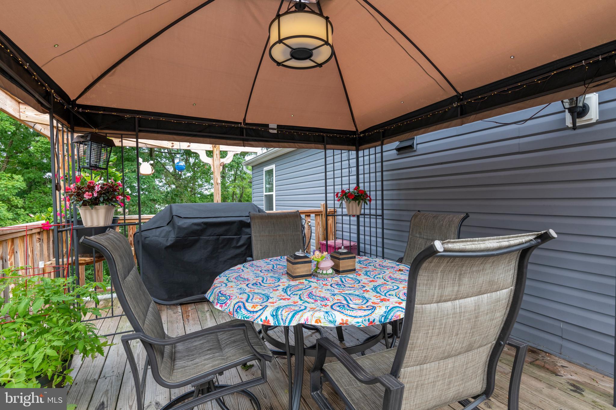 8624 Lawrence Hill Road Perry Hall, MD 21128 - Photo 34 of 39 a patio with table and chairs