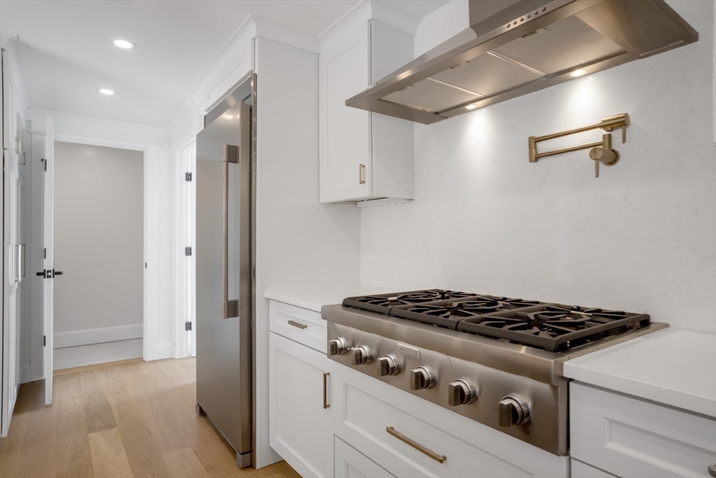 31 Lancaster Road Newton, MA 02458 - Photo 3 of 30 a stove top oven sitting inside of a kitchen
