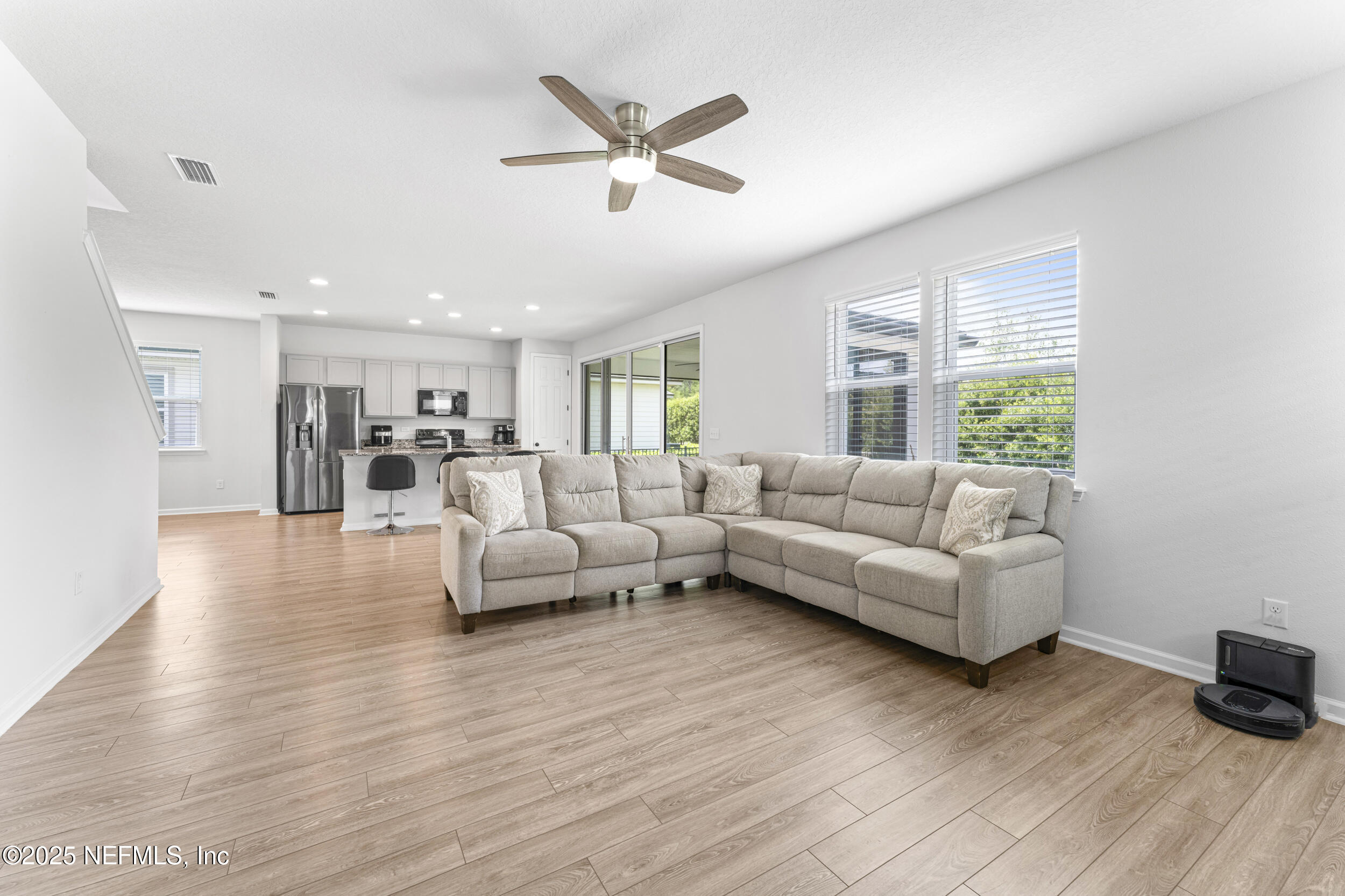 513 Sandstone Drive St. Augustine, FL 32086 - Photo 12 of 56 a living room with furniture and a large window