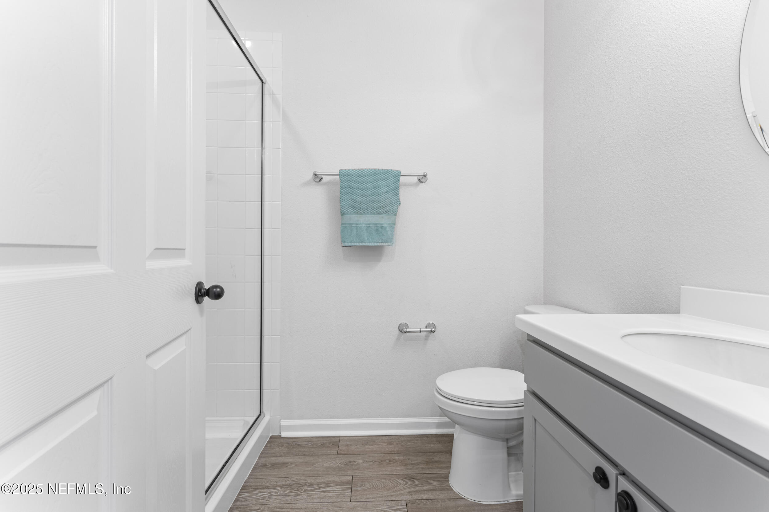 513 Sandstone Drive St. Augustine, FL 32086 - Photo 19 of 56 a bathroom with a toilet a sink and wooden floor