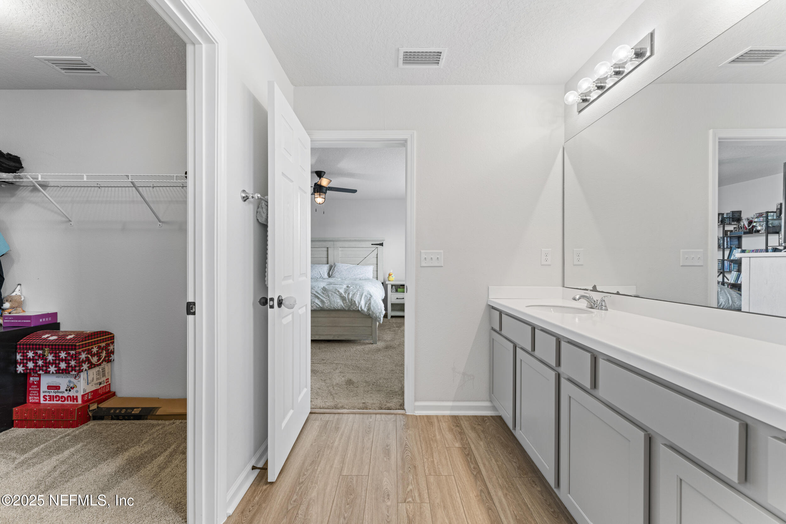 513 Sandstone Drive St. Augustine, FL 32086 - Photo 27 of 56 a en suite bathroom with a sink and mirror
