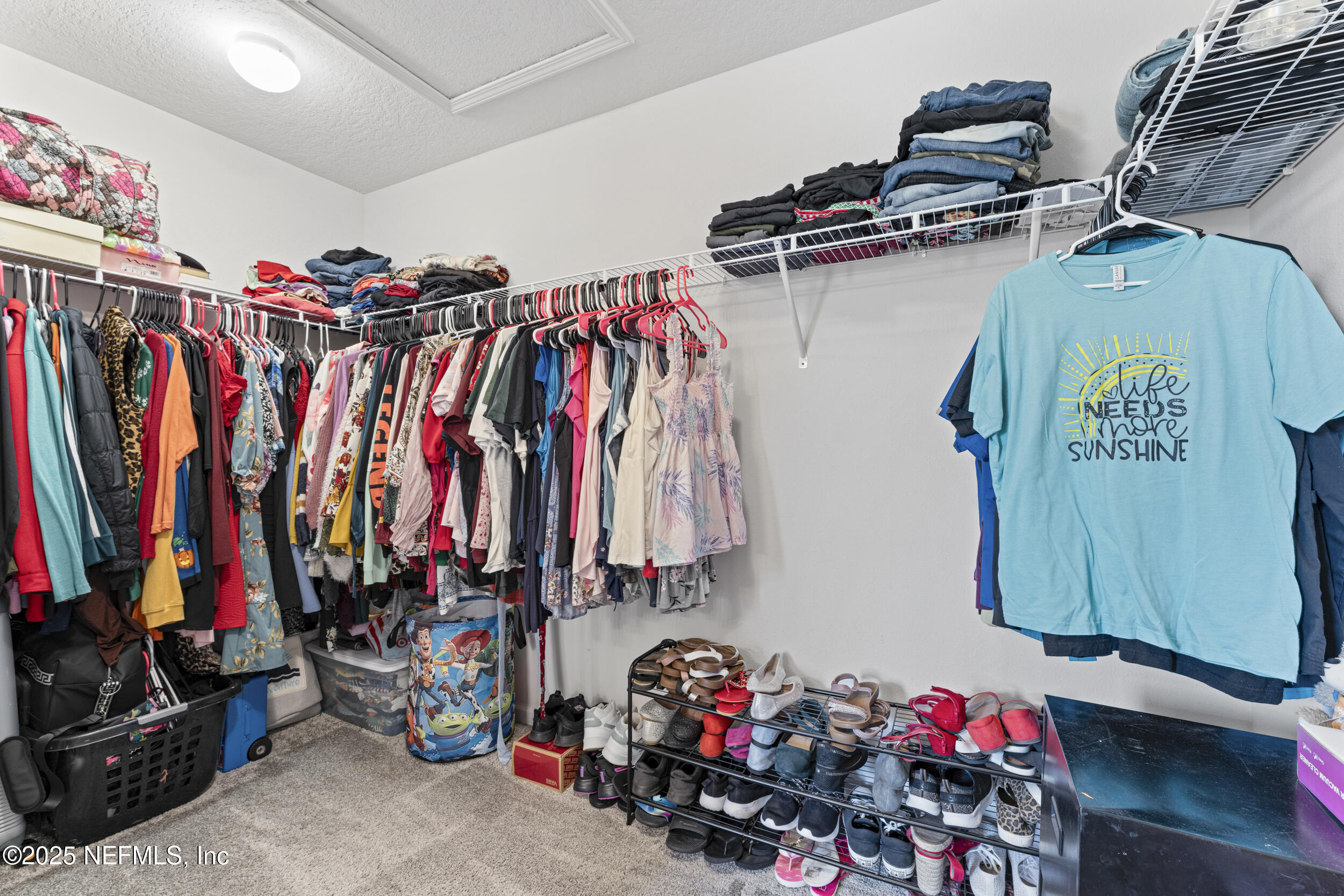 513 Sandstone Drive St. Augustine, FL 32086 - Photo 28 of 56 a view of walk in closet with clothes