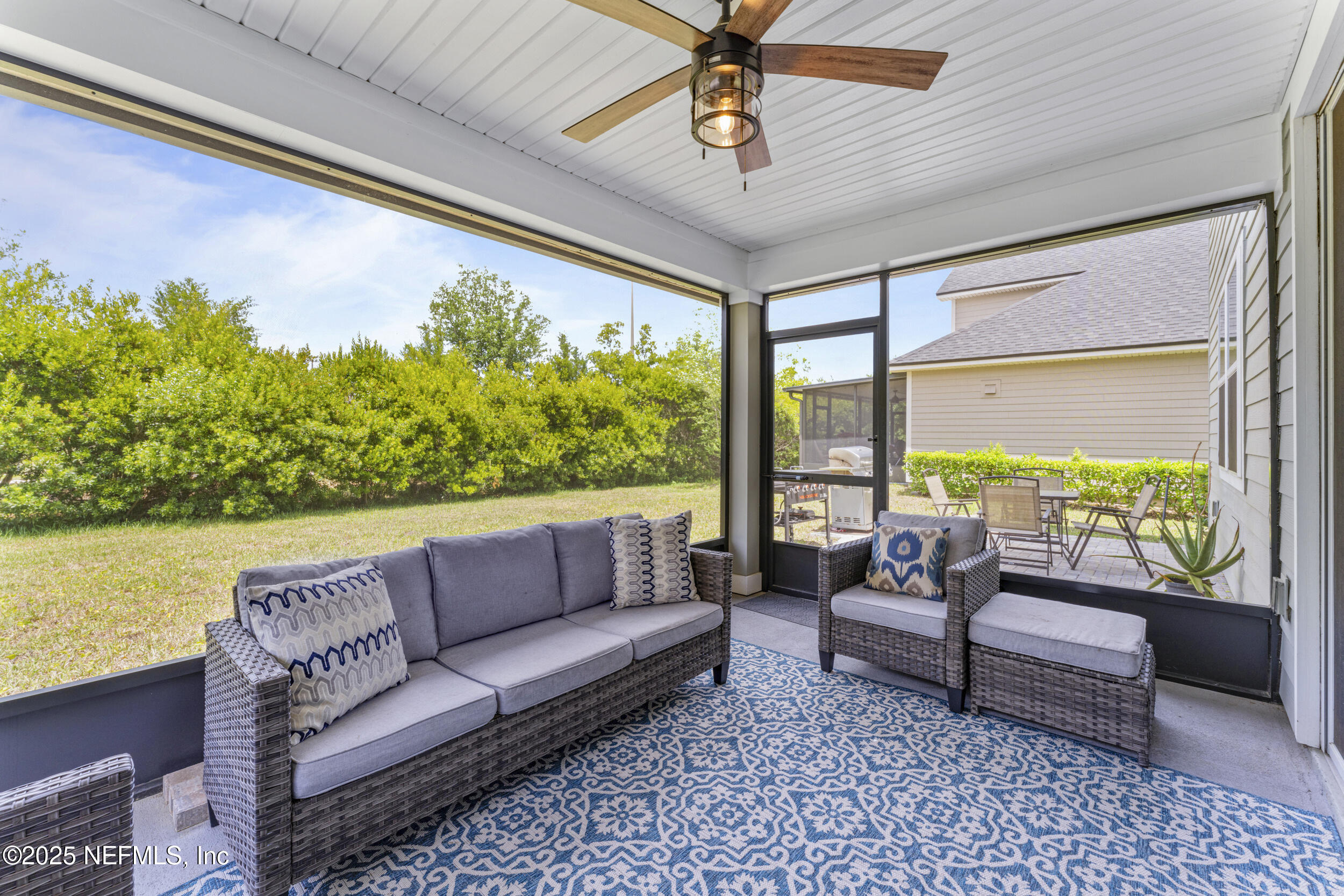 513 Sandstone Drive St. Augustine, FL 32086 - Photo 34 of 56 a living room with furniture and a large window