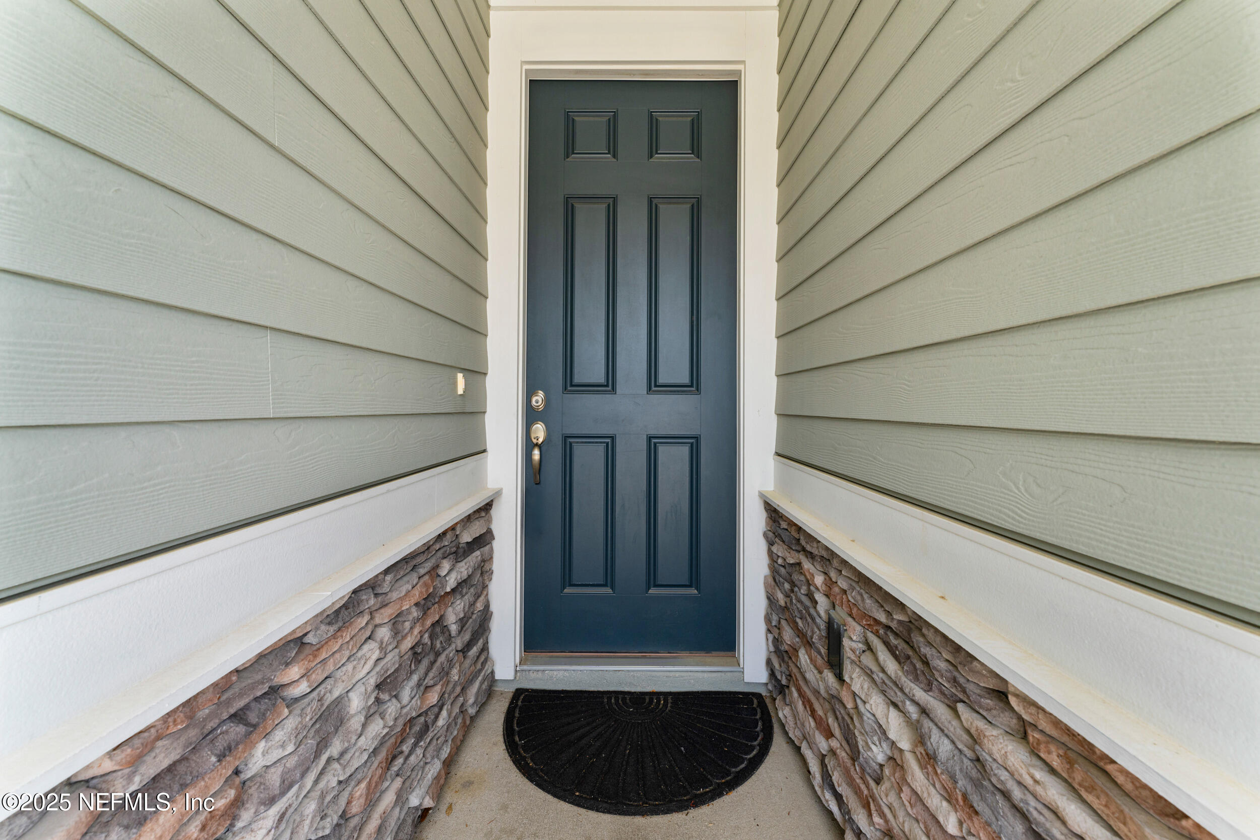 513 Sandstone Drive St. Augustine, FL 32086 - Photo 4 of 56 a view of front door of house