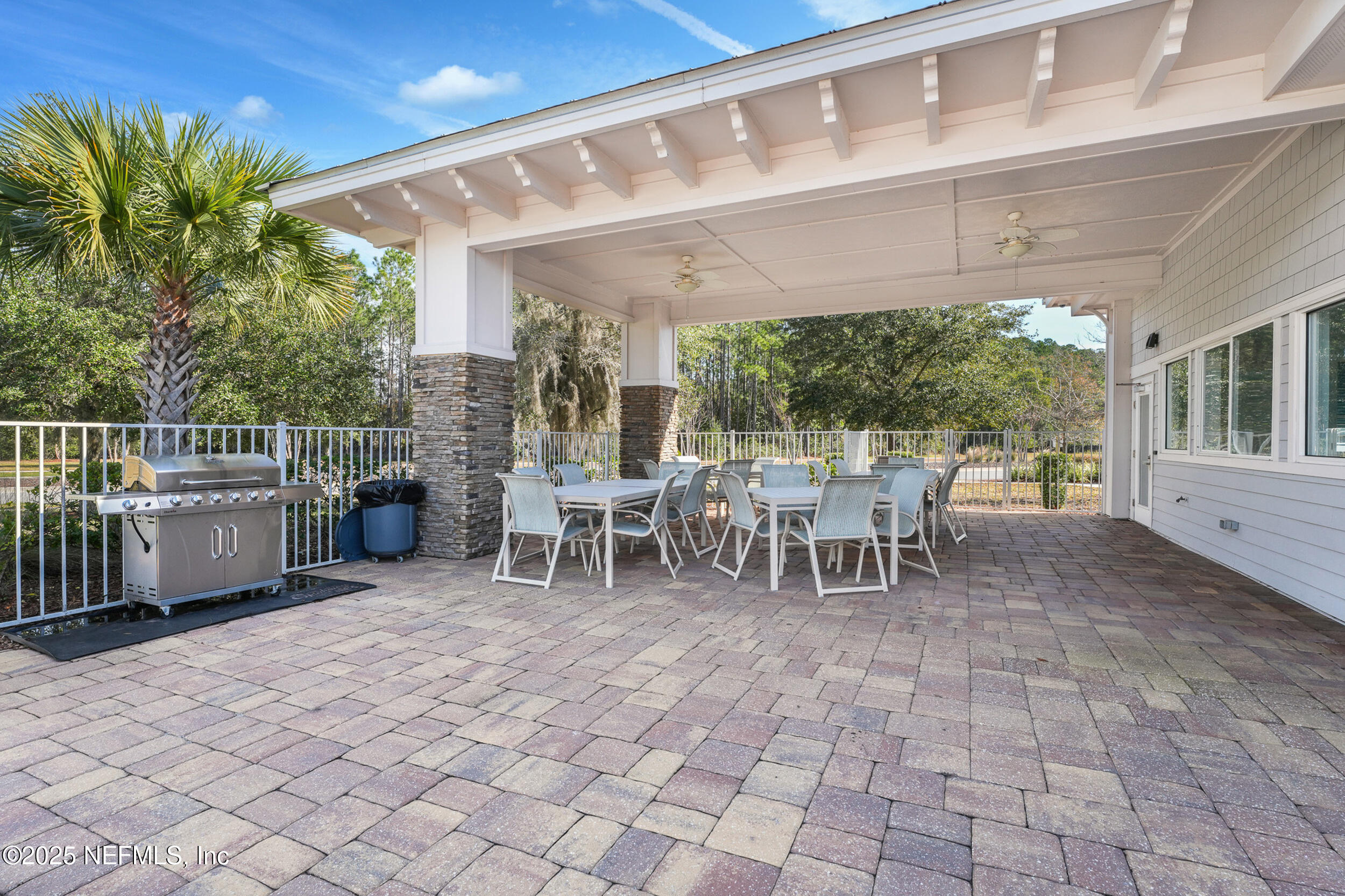513 Sandstone Drive St. Augustine, FL 32086 - Photo 52 of 56 a dining area with a table tennis table and chairs