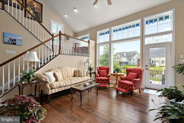 a kitchen with stainless steel appliances kitchen island granite countertop a sink stove and wooden cabinets