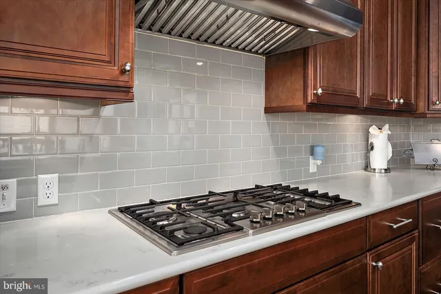 a bathroom with a double vanity sink mirror and shower
