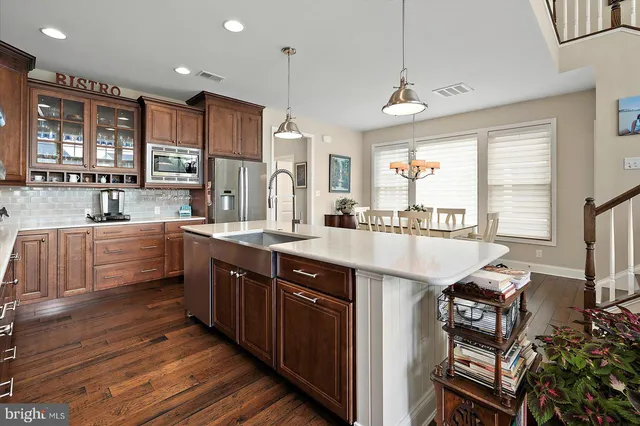 a view of entryway with wooden floor and stairs