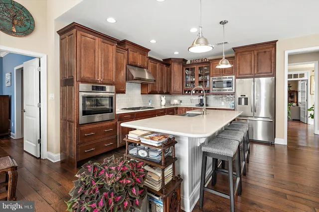 a view of a workspace with furniture and window