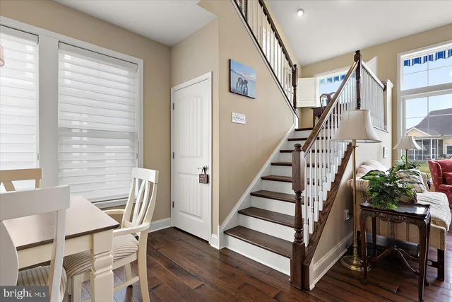 a bedroom with a bed and a flat tv screen on dresser