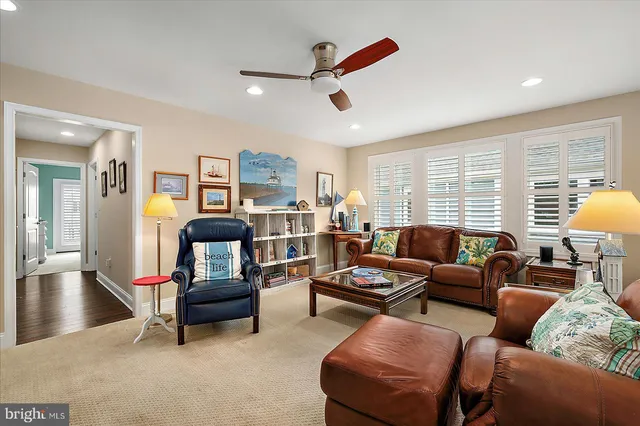 a view of a workspace with furniture and wooden floor