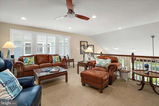 an aerial view of residential houses with outdoor space and swimming pool