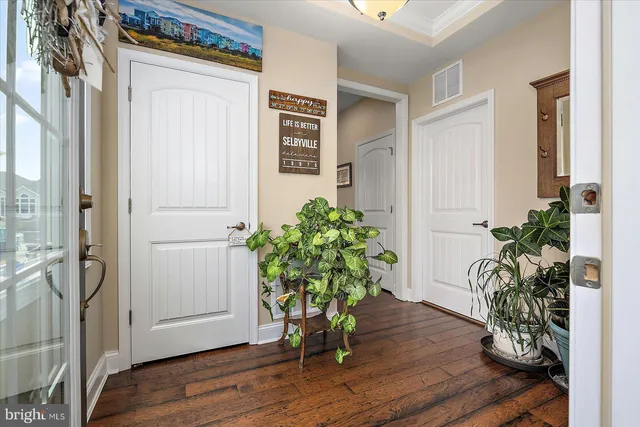 a large kitchen with cabinets table and chairs
