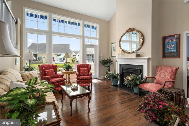 a kitchen with stainless steel appliances granite countertop a sink refrigerator and cabinets