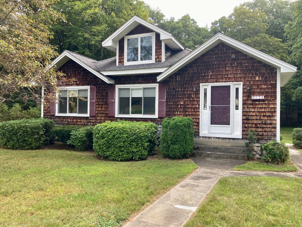 124 Bailey Road Holden, MA 01520 - Photo 1 of 37 a front view of a house with garden