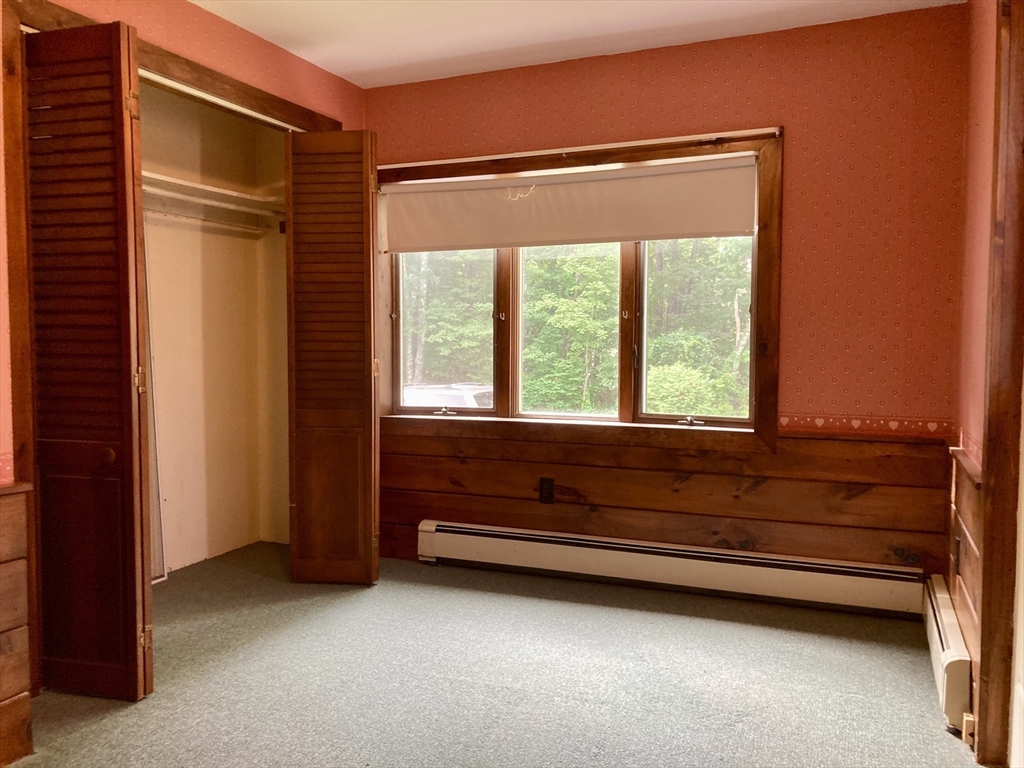 124 Bailey Road Holden, MA 01520 - Photo 17 of 37 a view of room with window and a ceiling fan