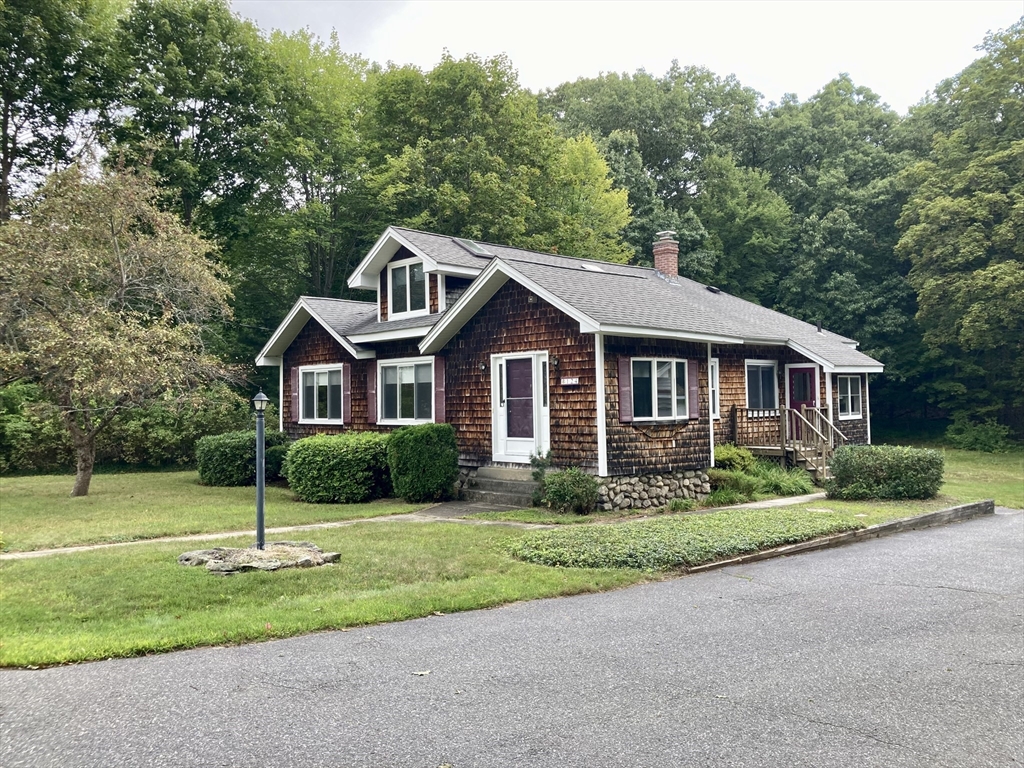124 Bailey Road Holden, MA 01520 - Photo 2 of 37 a front view of a house with a yard