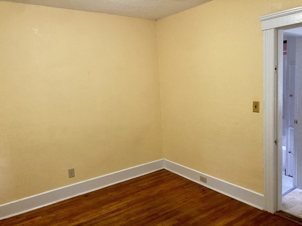 124 Bailey Road Holden, MA 01520 - Photo 24 of 37 a view of a small space with wooden floor and a window