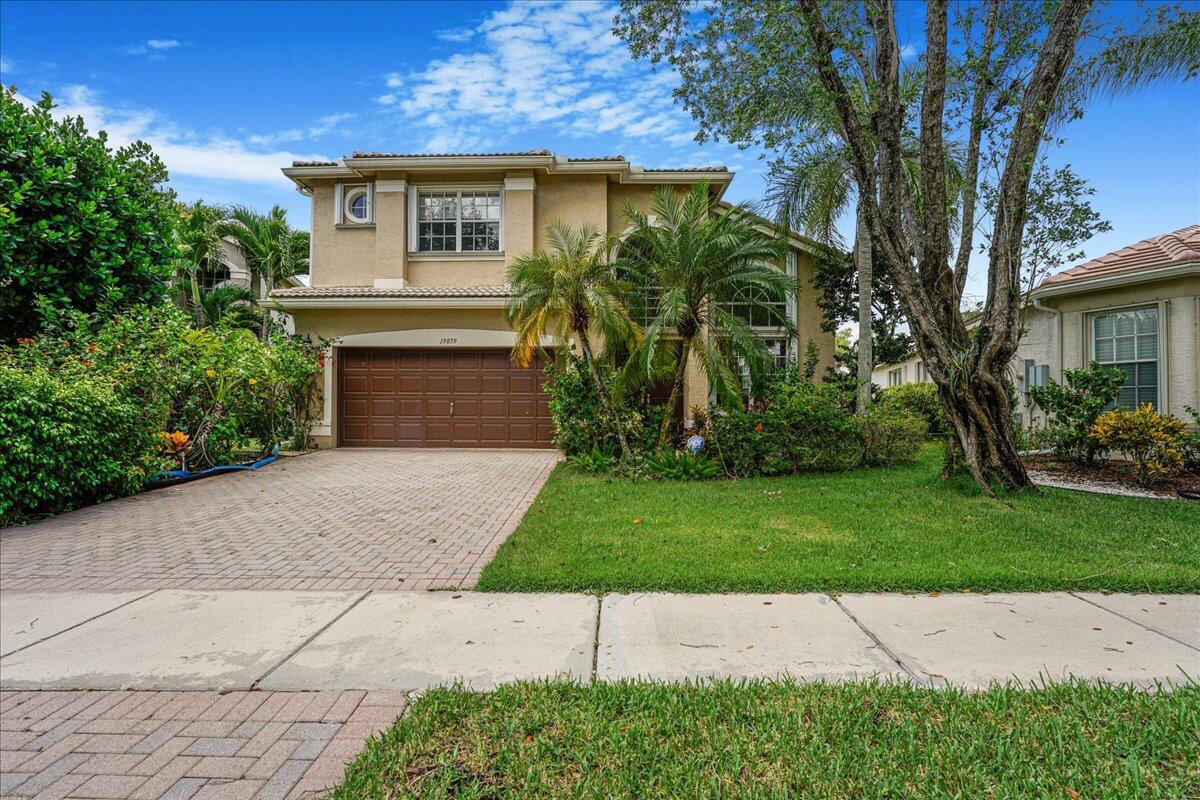 19059 Skyridge Circle Boca Raton, FL 33498 - Photo 1 of 40 a view of a house with a yard