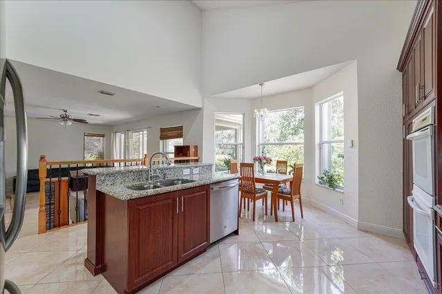 a kitchen with a table and chairs