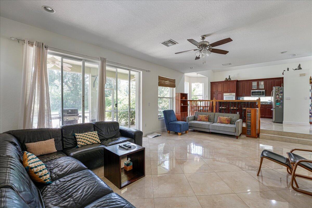 19059 Skyridge Circle Boca Raton, FL 33498 - Photo 17 of 40 a living room with furniture and a large window