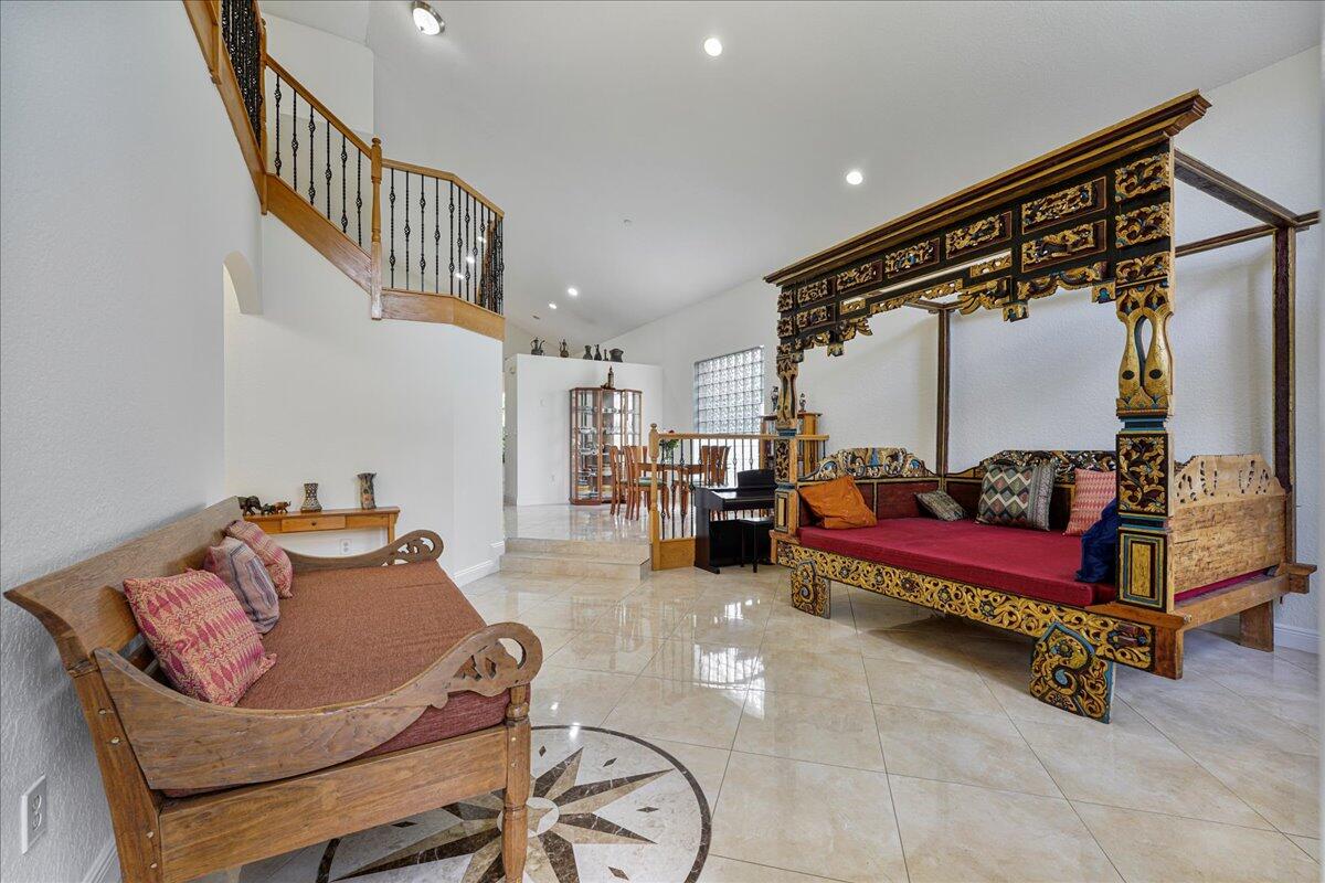 19059 Skyridge Circle Boca Raton, FL 33498 - Photo 21 of 40 a bedroom with furniture and a book shelf