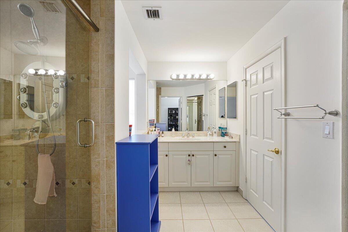 19059 Skyridge Circle Boca Raton, FL 33498 - Photo 24 of 40 a bathroom with a double vanity sink mirror and shower