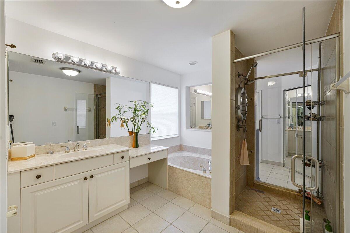 19059 Skyridge Circle Boca Raton, FL 33498 - Photo 25 of 40 a spacious bathroom with a shower sink double mirror and a shower