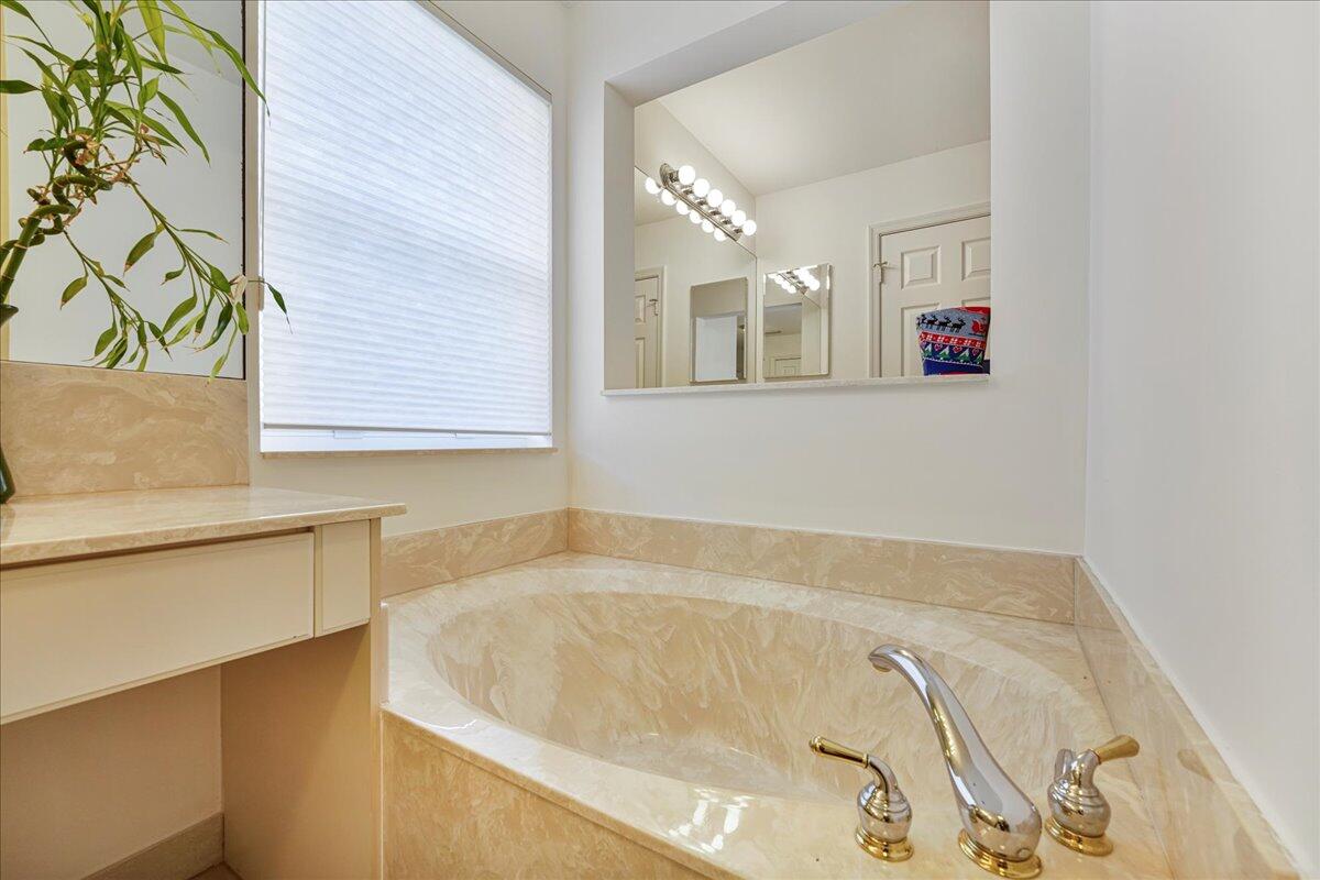 19059 Skyridge Circle Boca Raton, FL 33498 - Photo 26 of 40 a bath tub sitting next to a window