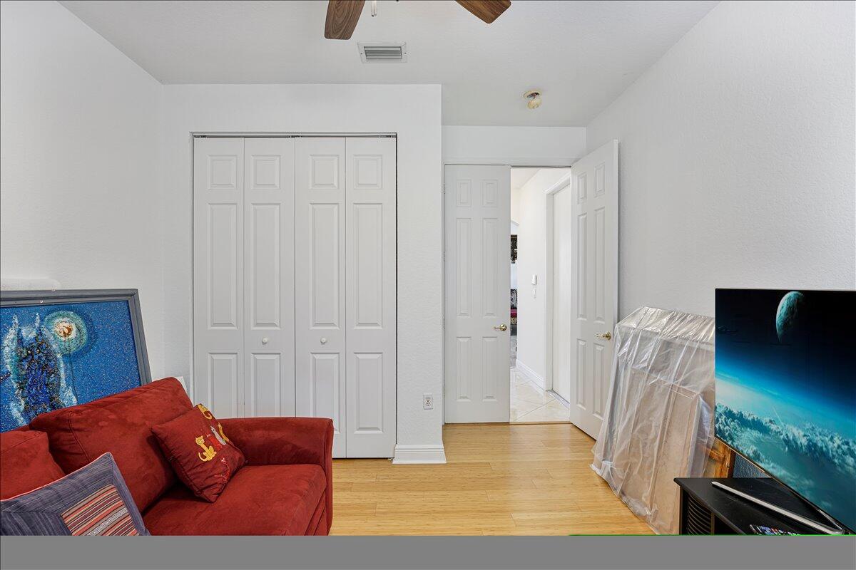 19059 Skyridge Circle Boca Raton, FL 33498 - Photo 29 of 40 a living room with furniture and a flat screen tv