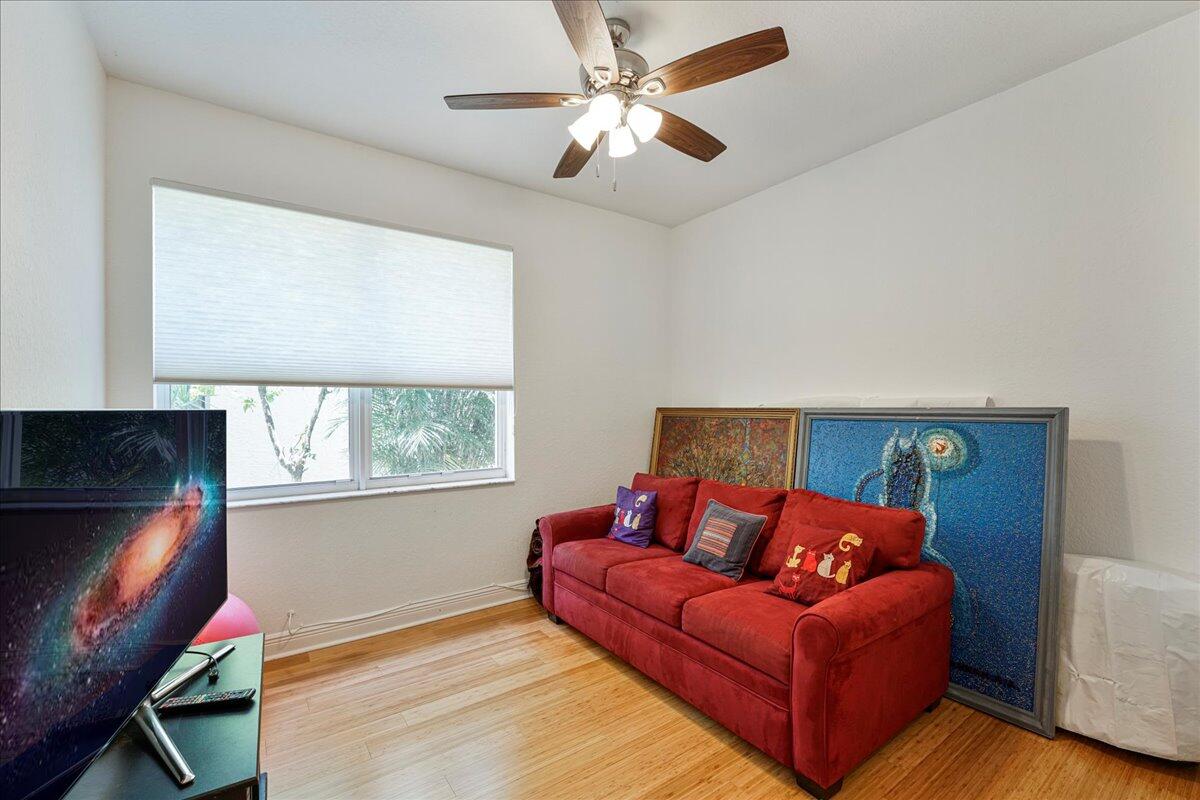 19059 Skyridge Circle Boca Raton, FL 33498 - Photo 30 of 40 a living room with furniture and a flat screen tv