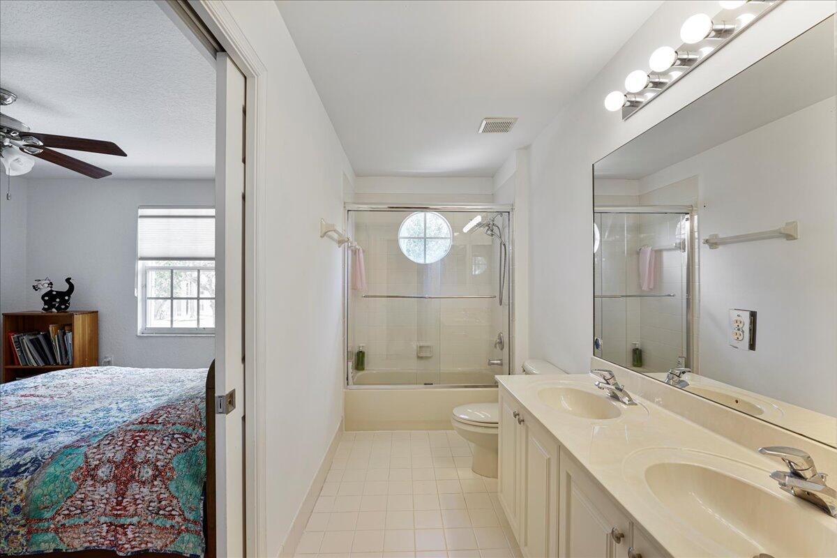 19059 Skyridge Circle Boca Raton, FL 33498 - Photo 32 of 40 a bathroom with a double vanity sink mirror double and shower