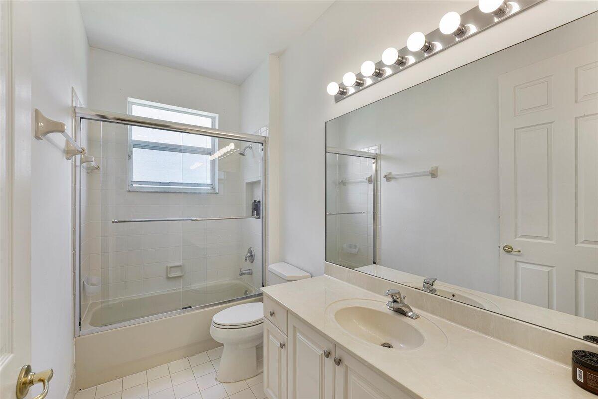 19059 Skyridge Circle Boca Raton, FL 33498 - Photo 33 of 40 a bathroom with a sink a toilet and shower