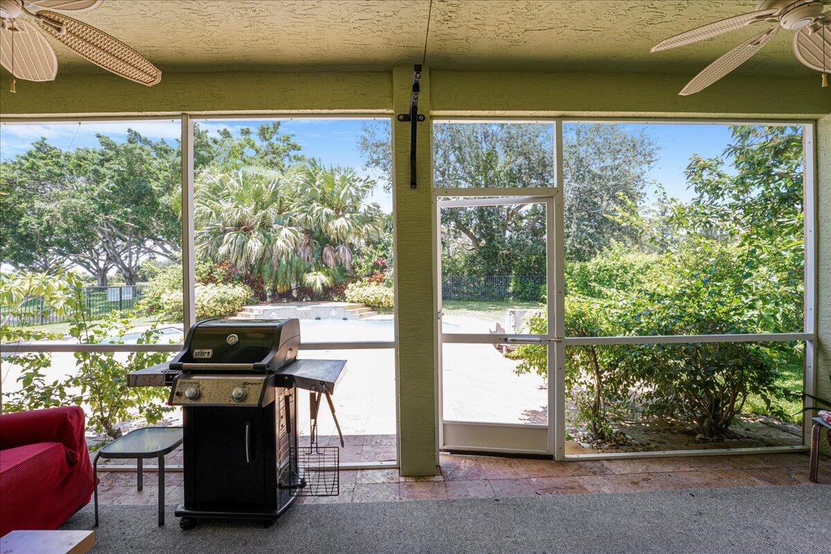 19059 Skyridge Circle Boca Raton, FL 33498 - Photo 38 of 40 a view of a two chair in the patio next to a yard